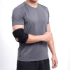 man wearing the elbow support brace main product image