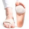 A pair of cushioned pads designed for Morton’s Neuroma support is shown on a woman’s foot against a plain white background. The soft gel cushion rests beneath the forefoot, providing shock absorption and reducing pressure on the metatarsal area. A contoured metatarsal bar lifts and separates the toes, aligning the bones to alleviate nerve compression. Breathable fabric wraps around the foot, securing the pad in place while moisture-wicking materials ensure comfort. The slim, low-profile design integrates discreetly with footwear, offering targeted relief for ball-of-foot discomfort. Reinforced edges prevent shifting during movement, maintaining consistent support throughout the day.