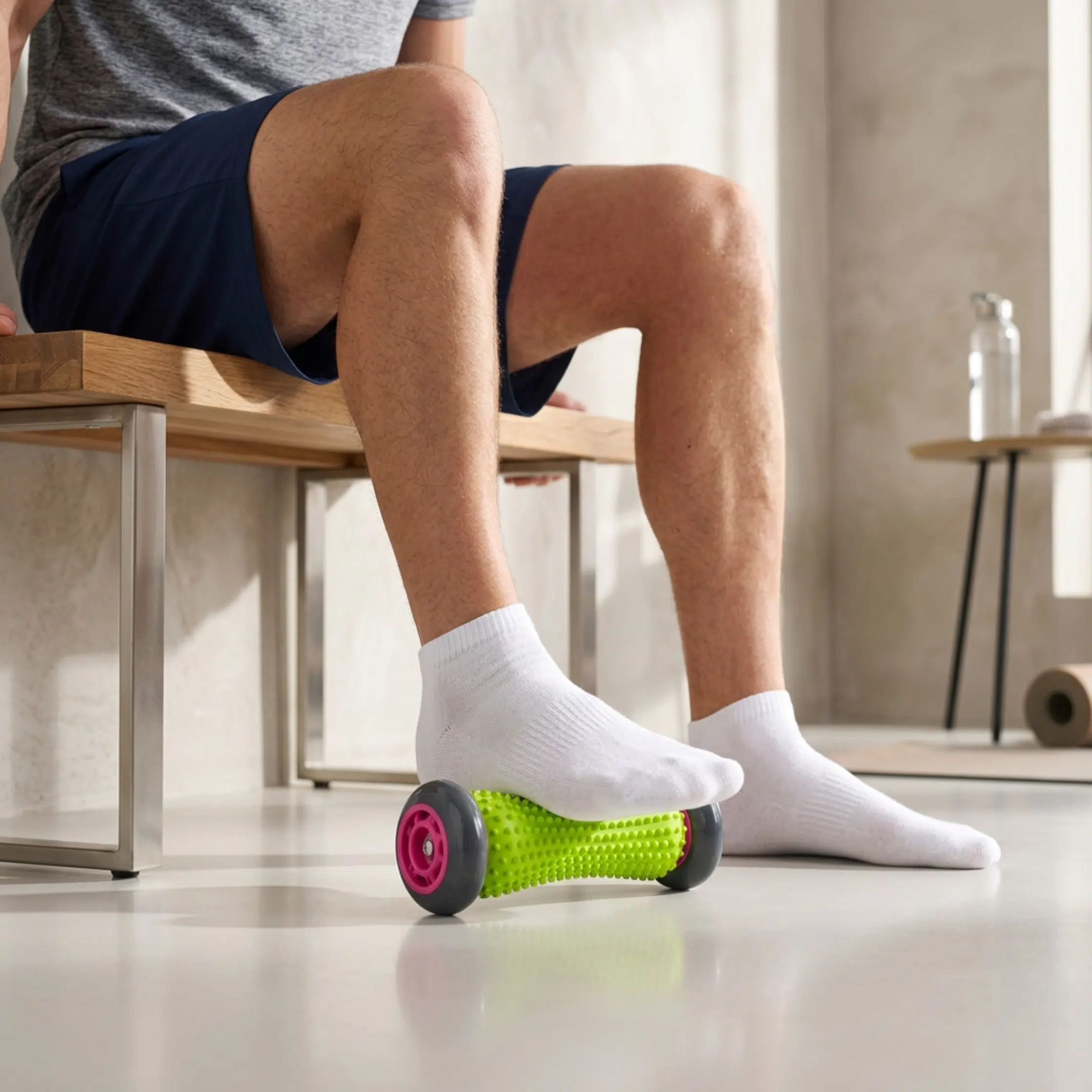 foot-roller-in-use man in the gym using the foot roller