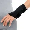 Women's Wrist Support Brace fit snugly around a woman's hand, providing gentle compression, stabilization, and support for various wrist injuries and conditions to aid in recovery and enhance comfort during daily activities.
