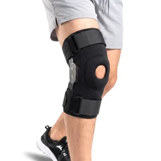 medical hinged knee brace being worn by man